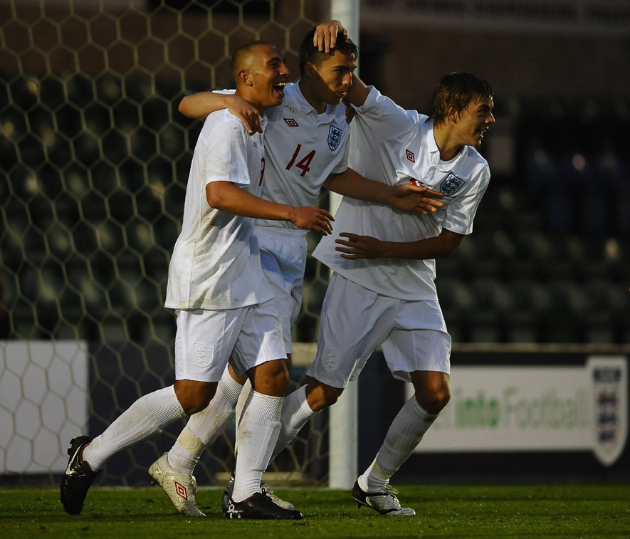 Matty Regan (centre) is congratulated by Hallam Hope (left) and Sam Magri after scoring the equaliser against Turkey.